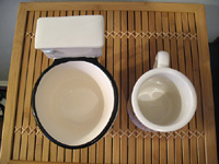 Toilet mug in comparison with standard coffee mug size.