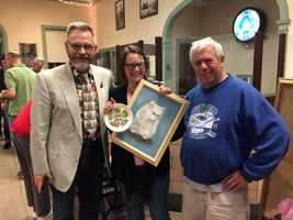 The judges pose with the first-place winner