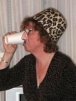Her Serene Tackiness, Julie Mangin, demonstrates the Pick Your Nose party cups