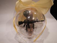 Gun totin' black fetus Christmas ornament, from Miss Poppy.com (sadly, now defunct)